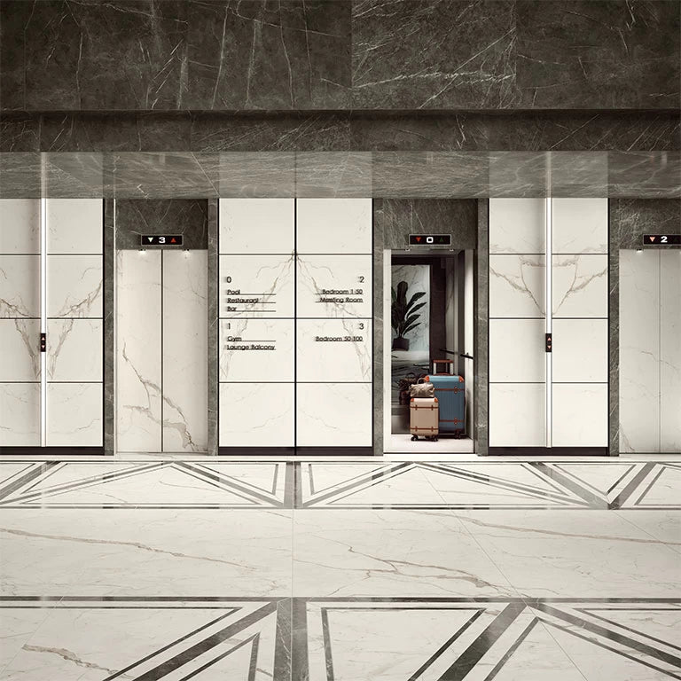Calacatta Prestigio marble elevator lobby with white veined panels and polished finish — custom countertops fabricated and installed by Signature Stone LV
