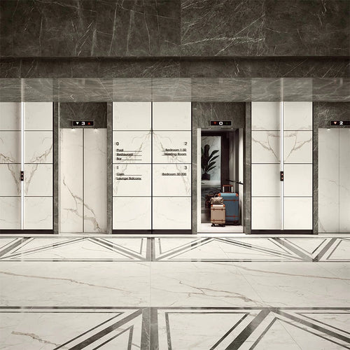 Calacatta Prestigio marble elevator lobby with white veined panels and polished finish — custom countertops fabricated and installed by Signature Stone LV