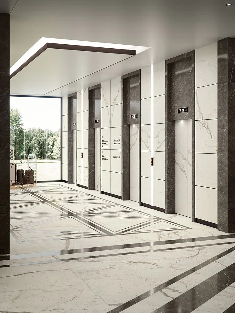 Calacatta Prestigio marble elevator lobby with white veined panels and dark trim — expert countertop fabrication by Signature Stone Las Vegas
