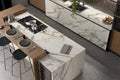 Calacatta Dorato kitchen island with white marble veining and waterfall edge — luxury stone countertops installed by Signature Stone Las Vegas