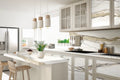 Calacatta Gold kitchen countertops with white marble veining and matching backsplash — elegant stone countertops installed by Signature Stone Las Vegas