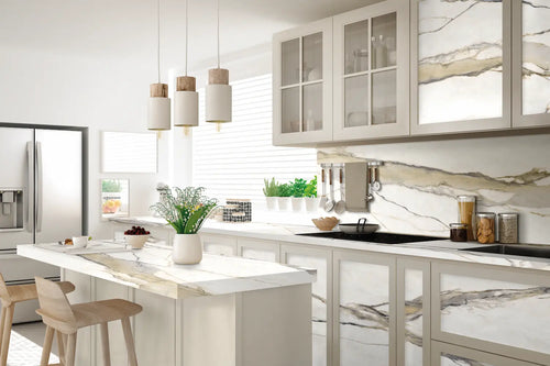 Calacatta Gold kitchen countertops with white marble veining and matching backsplash — elegant stone countertops installed by Signature Stone Las Vegas