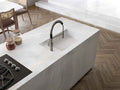 Chamonix quartz kitchen island with integrated sink and sleek white finish — premium stone countertops installed by Signature Stone Las Vegas