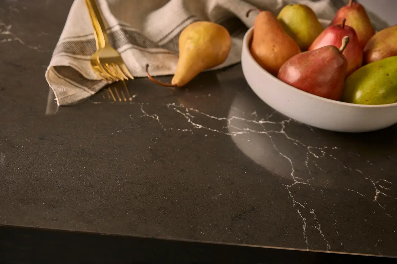 Quartz kitchen countertop with dark marble veining and polished finish — elegant stone countertops installed by Signature Stone Las Vegas