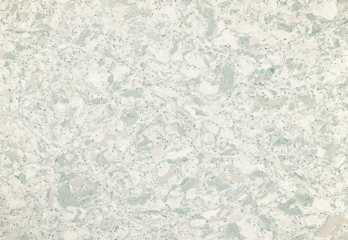Quartz surface with soft sage green and cream veining throughout speckled white base — custom countertops fabricated and installed by Signature Stone LV