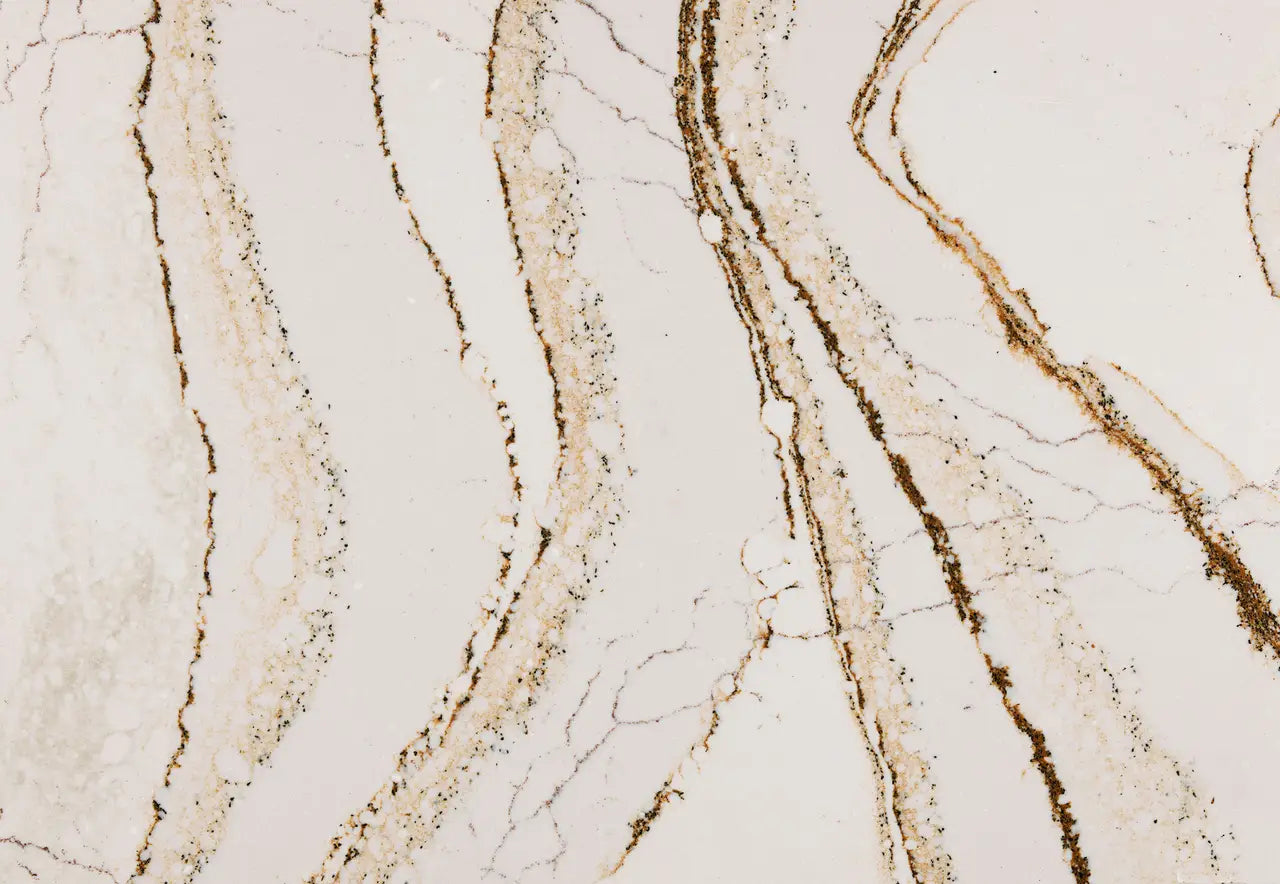 Clovelly marble surface with elegant white base and flowing gold-brown veining — premium stone countertops installed by Signature Stone Las Vegas