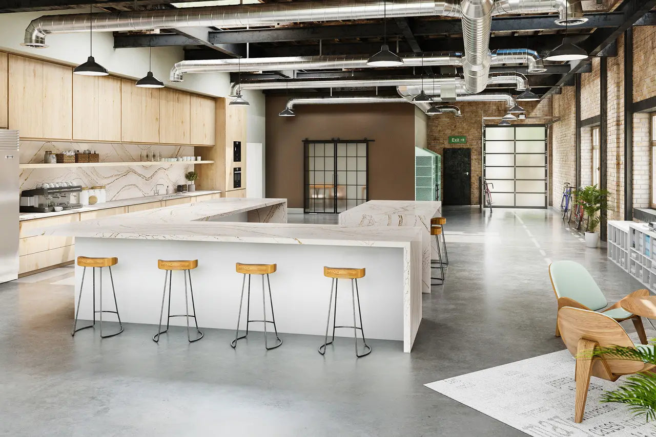 Quartz kitchen island with white marble-look veining and waterfall edge — premium countertop fabrication by Signature Stone Las Vegas