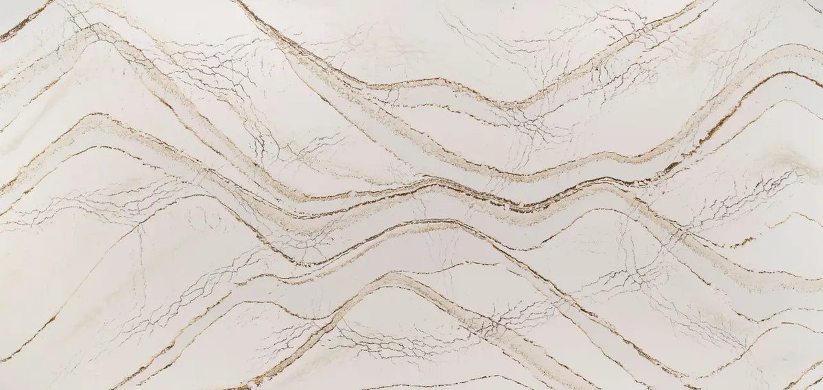 Clovelly quartz slab with flowing cream and beige veining and polished finish — ideal for custom countertops fabricated and installed by Signature Stone LV