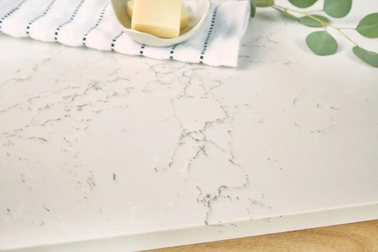 White marble surface with gray veining and clean edges — custom countertops fabricated and installed by Signature Stone LV