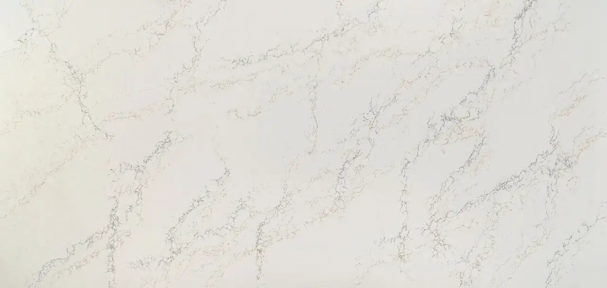 Quartz surface with elegant white base and subtle gray veining in polished finish — premium countertop fabrication by Signature Stone Las Vegas