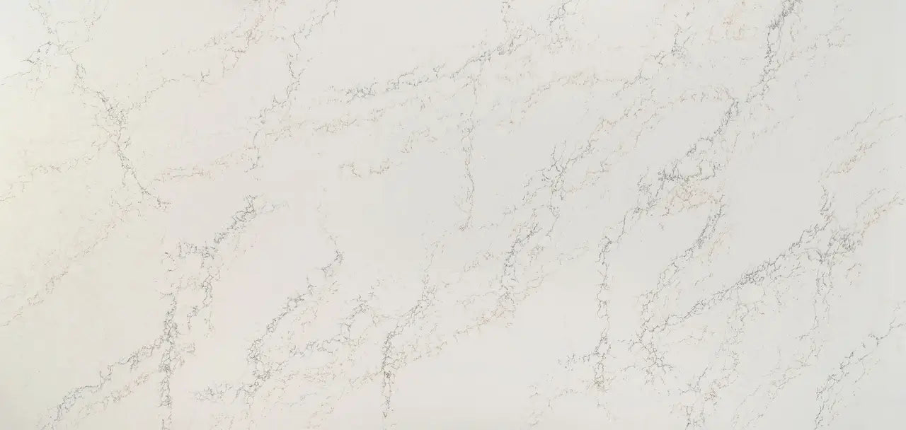 Quartz surface with elegant white base and subtle gray veining in polished finish — premium countertop fabrication by Signature Stone Las Vegas