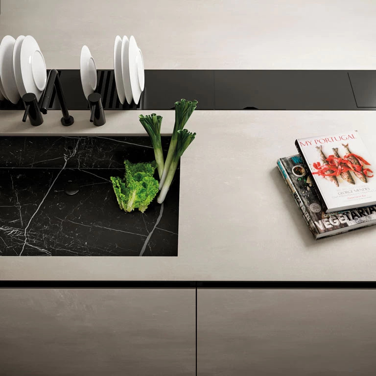 Boost White quartz kitchen countertop with integrated black marble sink and sleek white finish — modern stone countertops installed by Signature Stone Las Vegas