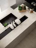 Boost White quartz kitchen countertops with black marble-look backsplash and integrated sink — premium stone countertops installed by Signature Stone Las Vegas