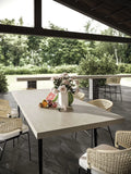 Cream Prestige outdoor dining table with smooth light surface — elegant stone countertops installed by Signature Stone Las Vegas