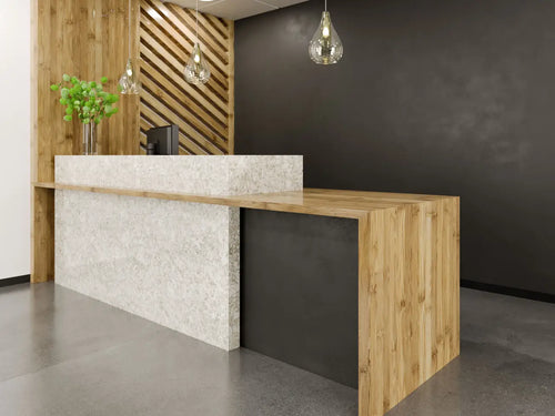 Quartz reception desk with white marbled surface and wood accents — premium stone countertops installed by Signature Stone Las Vegas