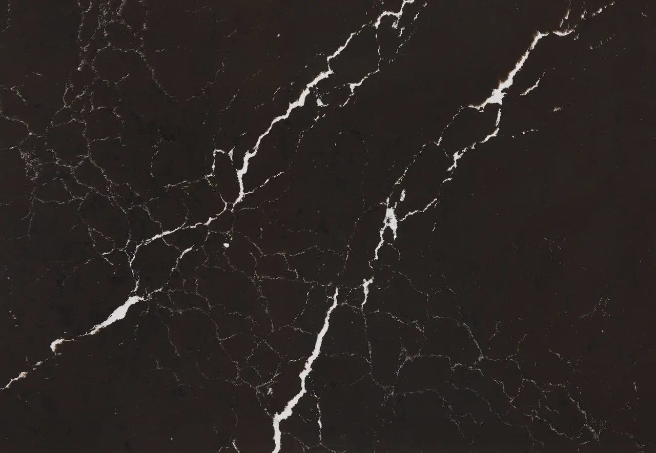 Delamere quartz surface with dramatic black background and bold white veining — custom countertops fabricated and installed by Signature Stone LV