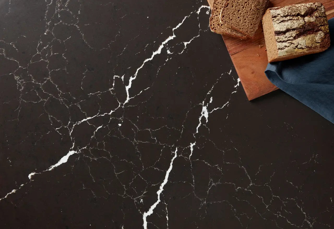 Delamere quartz surface with dramatic black base and bold white veining — custom countertops fabricated and installed by Signature Stone LV