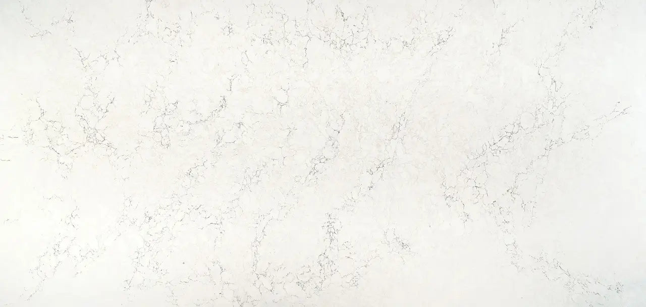 Dovestone quartz surface with elegant white background and subtle gray veining — premium stone countertops installed by Signature Stone Las Vegas