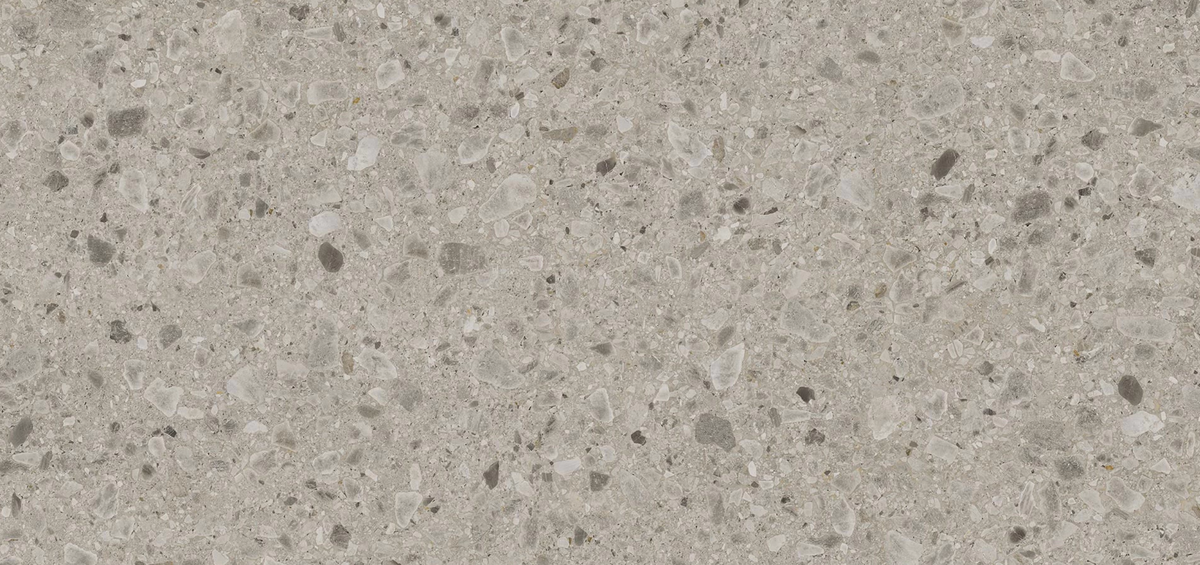 Kone Mix quartzite countertop slab with a subtle blend of light gray and beige tones featuring small, scattered natural stone details, ideal for modern kitchen countertops.