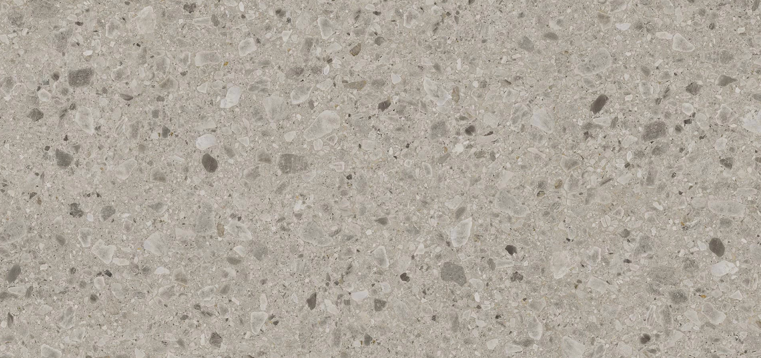 Kone Mix quartzite countertop slab with a subtle blend of light gray and beige tones featuring small, scattered natural stone details, ideal for modern kitchen countertops.