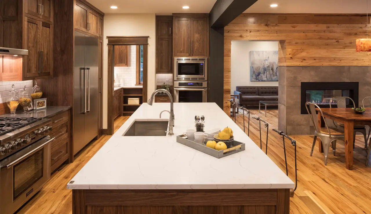 White quartz kitchen island with undermount sink and clean edges — modern stone countertops installed by Signature Stone Las Vegas