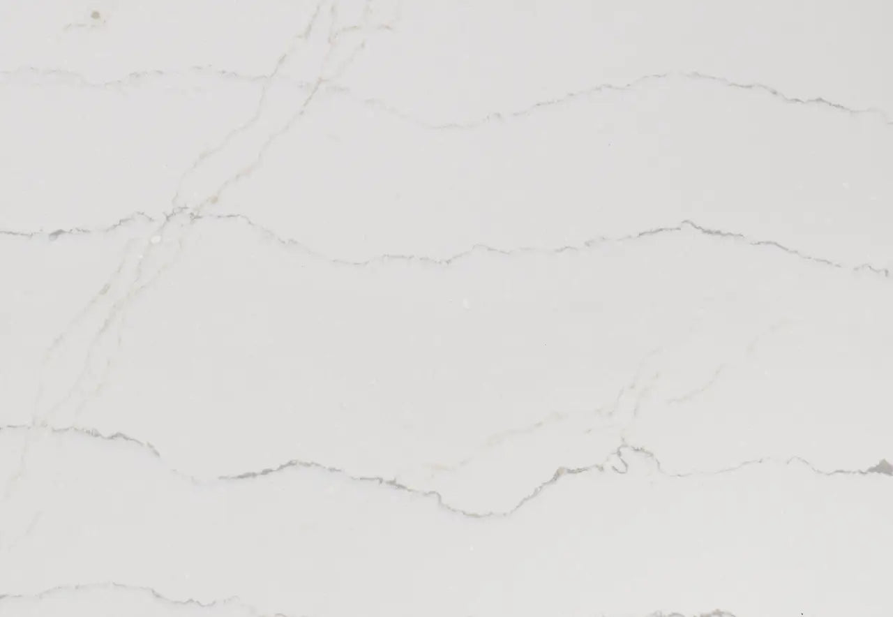 Ella quartz surface with soft white background and subtle gray veining in polished finish — custom countertops fabricated and installed by Signature Stone LV