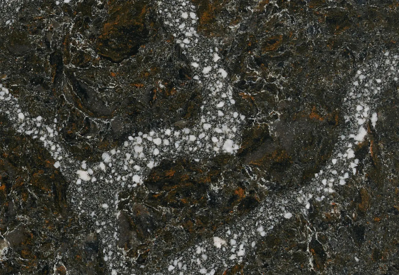 Ellesmere granite surface featuring dark charcoal base with white mineral veining and gold accents — custom countertops fabricated and installed by Signature...