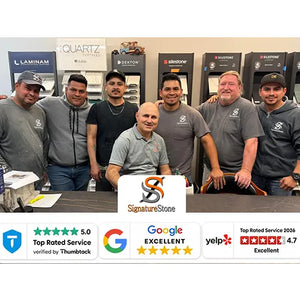 Group of seven men wearing Signature Stone logos posing inside a showroom with quartz and stone countertop samples displayed on the wall behind them, featuring customer service ratings from Google, Yelp, and Thumbtack.