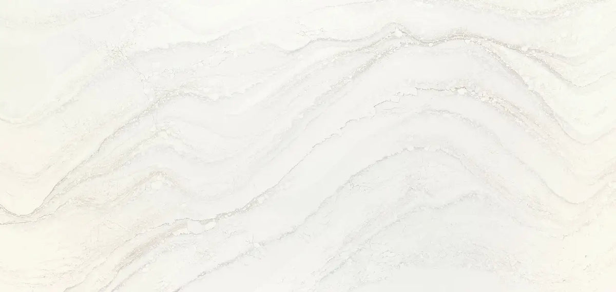 Calacatta marble slab with soft white background and delicate gray veining — custom countertops fabricated and installed by Signature Stone LV