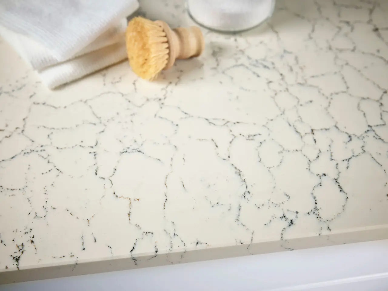 Falconwood quartz kitchen countertop with white marble-look veining and polished finish — elegant stone countertops installed by Signature Stone Las Vegas