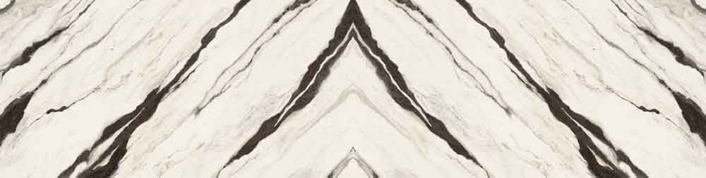 Glacier White quartzite slab with dramatic white and gray veining in chevron book-matched pattern — premium stone countertops installed by Signature Stone La...