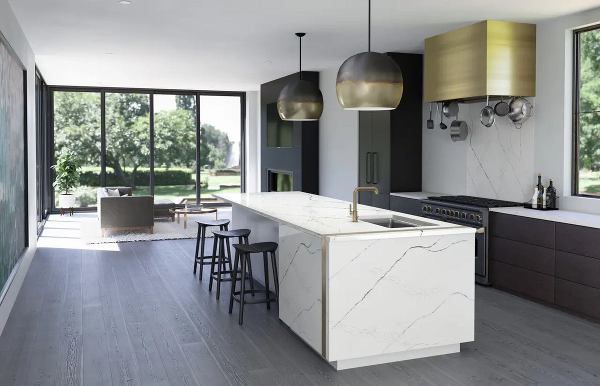 Calacatta marble kitchen island with waterfall edge and white veining — elegant stone countertops installed by Signature Stone Las Vegas