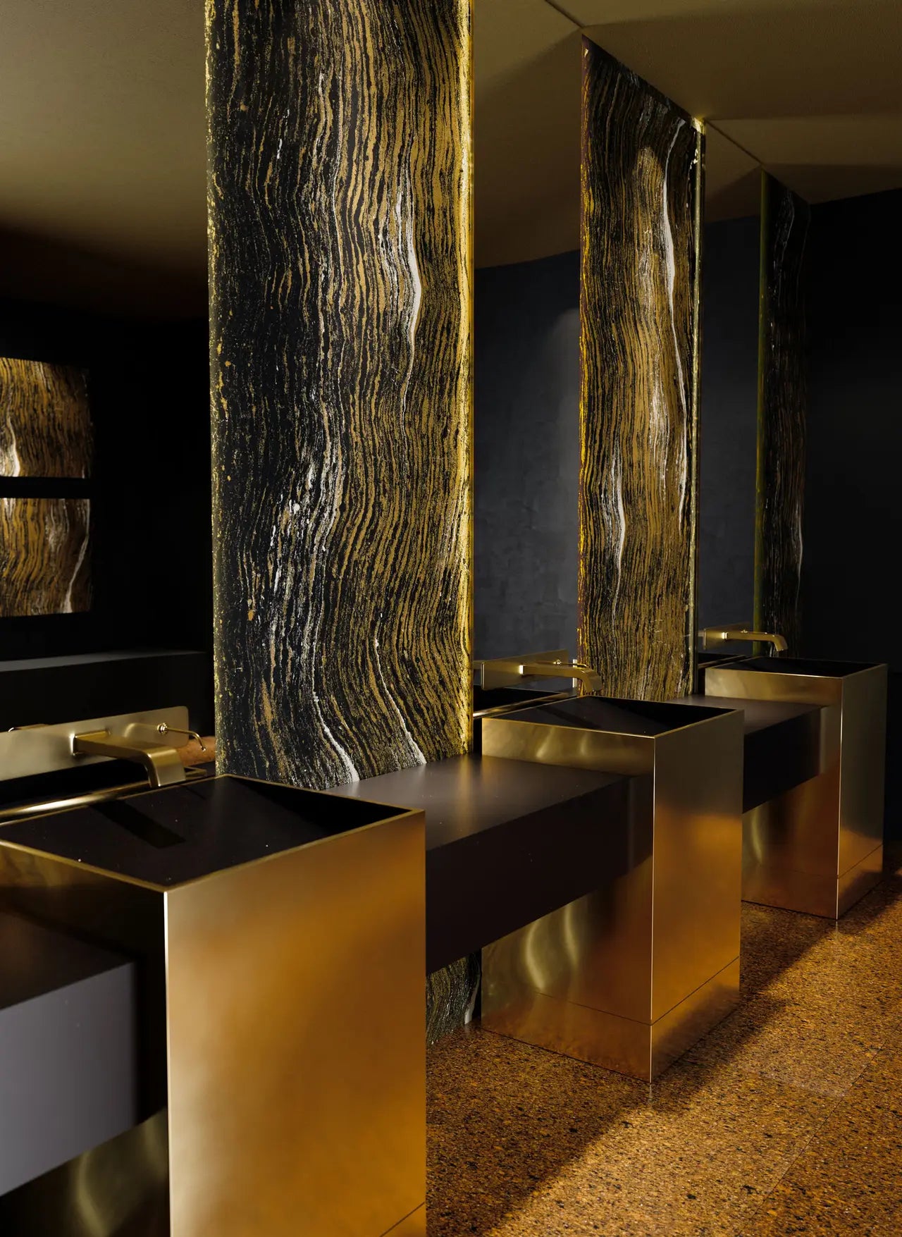 Modern bathroom with black and gold stone countertops, vertical stone slabs, and gold sinks