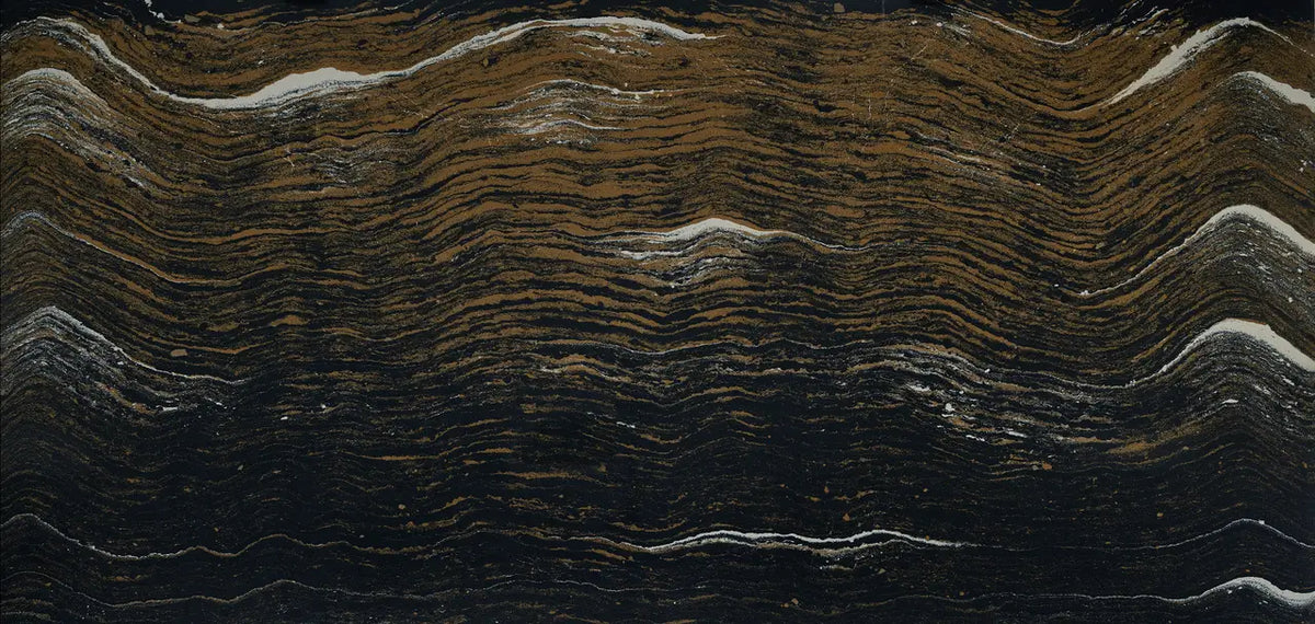 Black and gold quartzite slab with dramatic wavy veining and natural stone texture