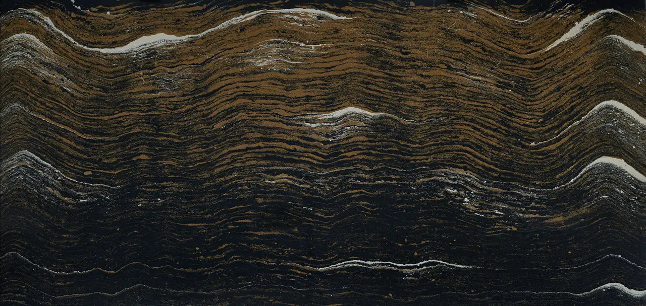 Black and gold quartzite slab with dramatic wavy veining and natural stone texture