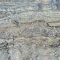 Azurite granite slab with swirling gray, beige, and blue patterns, ideal for countertops