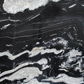 Copacabana granite slab with bold black background and dramatic white veining pattern
