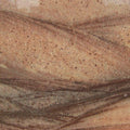 Granite countertop slab with red and brown veining, suitable for kitchen or bathroom surfaces