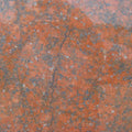 Red Dragon granite countertop surface with orange-red and gray veining