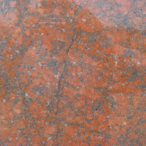 Red Dragon granite countertop surface with orange-red and gray veining