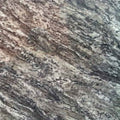 granite countertop slab with natural rocky brown and gray veining