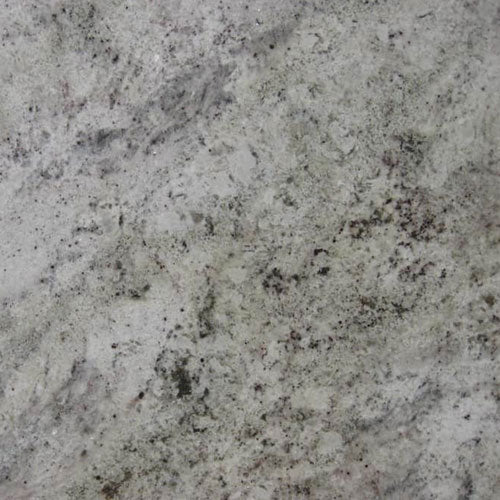 Salinas granite slab with light gray base and subtle dark speckled patterns for countertops