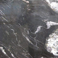 Granite countertop surface with black, white, and grey veining patterns