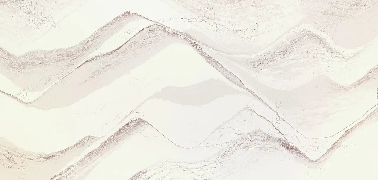 Marble surface with soft beige and cream veining in flowing wave patterns — premium countertop fabrication by Signature Stone Las Vegas