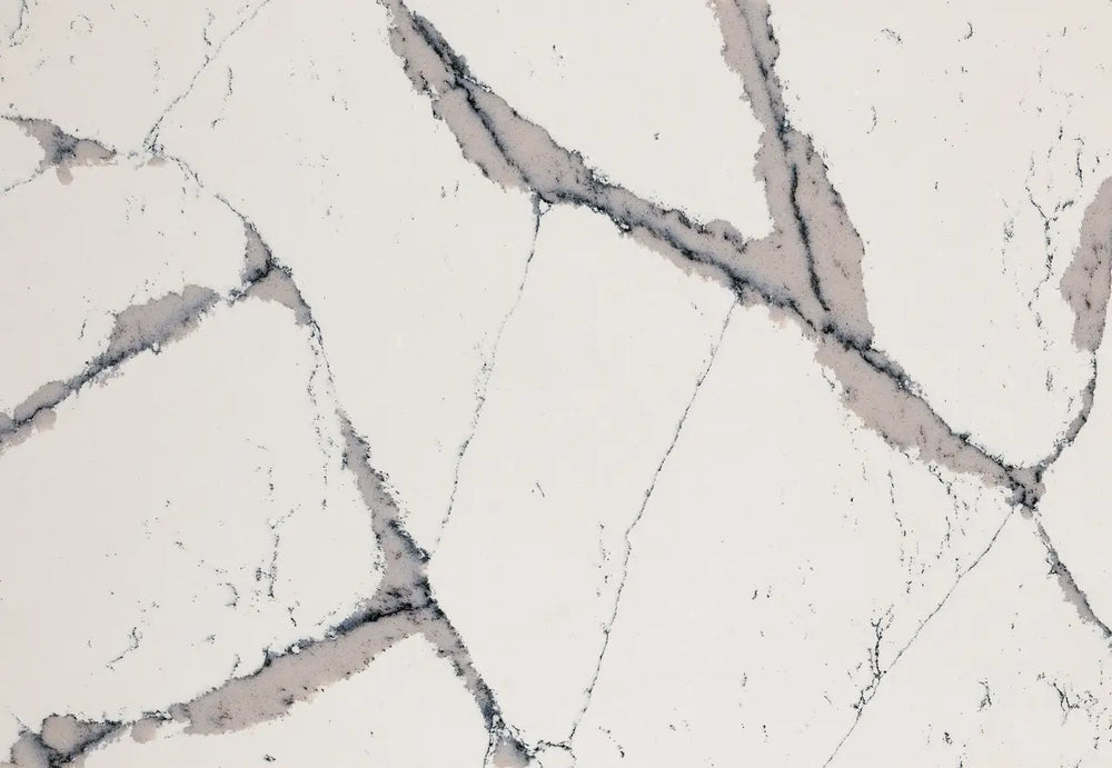 Quartz surface with white base and gray veining pattern — premium countertop fabrication by Signature Stone Las Vegas