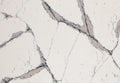 Quartz surface with white base and gray veining pattern — premium countertop fabrication by Signature Stone Las Vegas