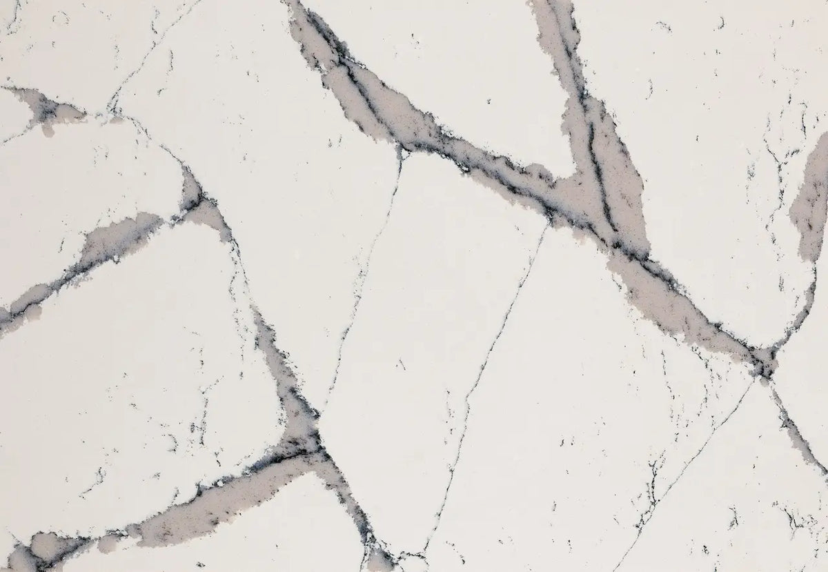 Quartz surface with white base and gray veining pattern — premium countertop fabrication by Signature Stone Las Vegas
