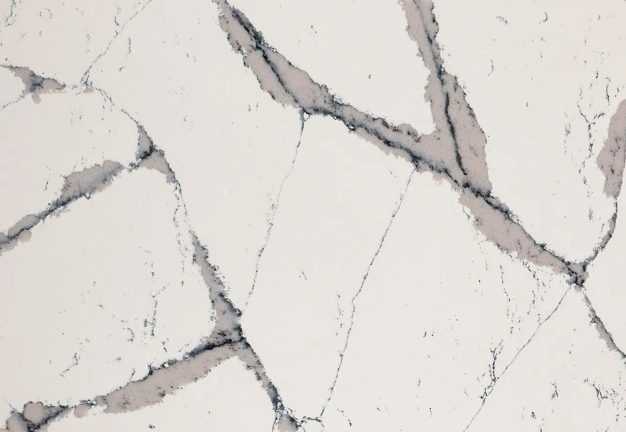 Quartz surface with white base and gray veining pattern — premium countertop fabrication by Signature Stone Las Vegas