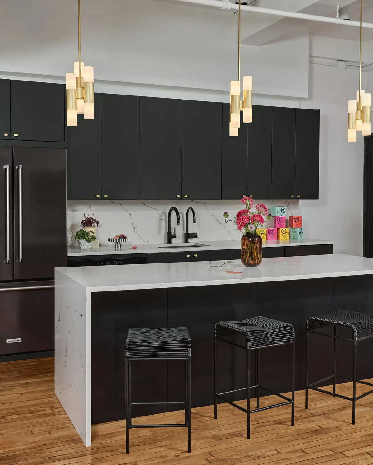 Quartz kitchen island and countertops with white marble veining and waterfall edge — expert countertop fabrication by Signature Stone Las Vegas