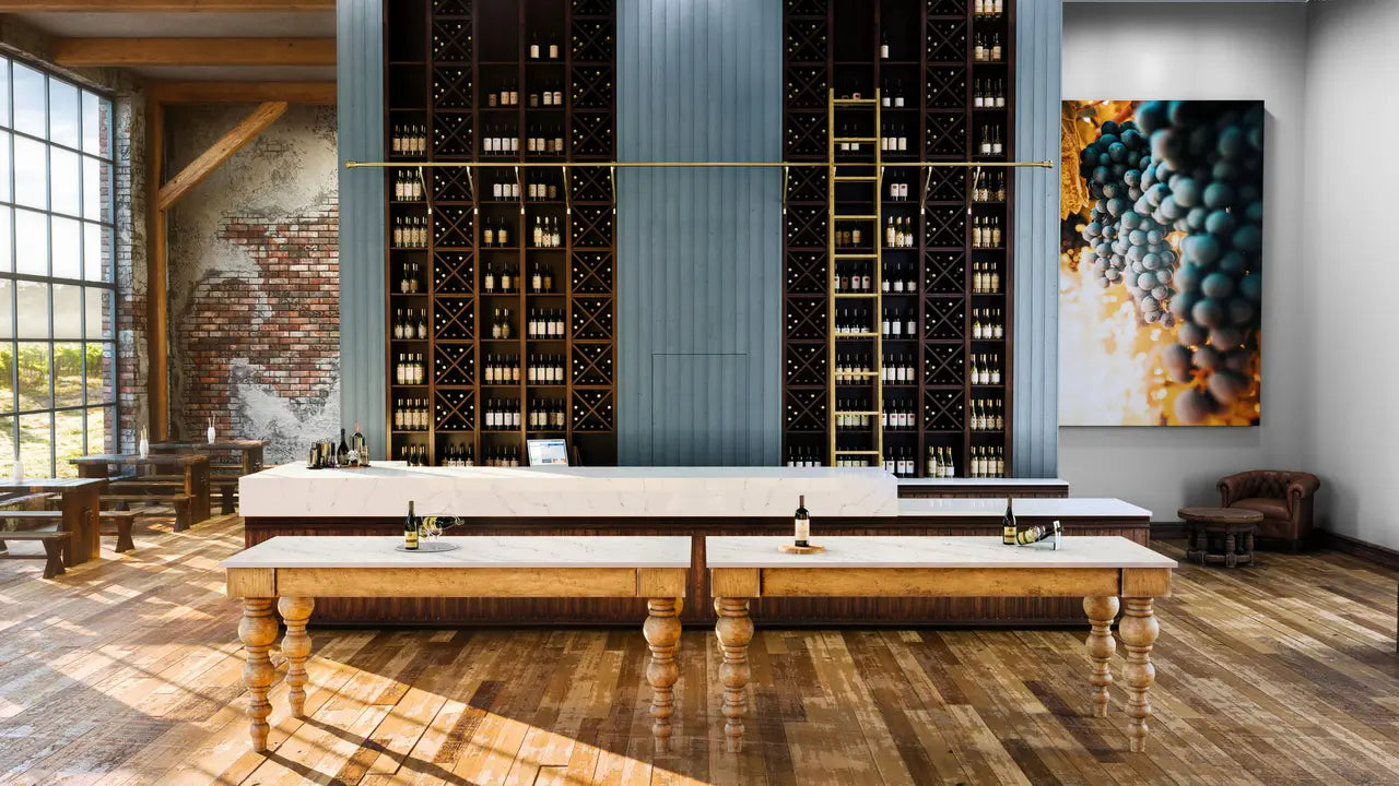 Hawksmoore stone wine tasting tables with white surfaces and brass accents — premium stone countertops installed by Signature Stone Las Vegas